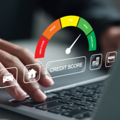 Person using a laptop to check their credit score, illustrating how to rebuild your credit score.