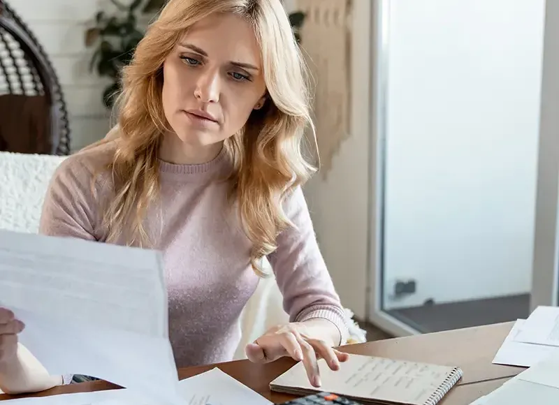woman looking at papers