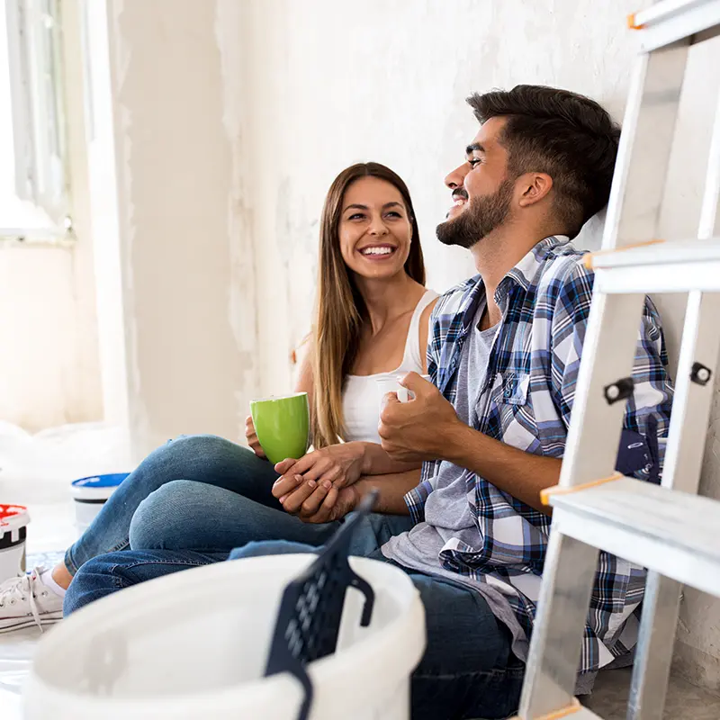 couple sittin gon floor in home