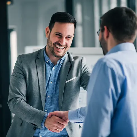 men shaking hands finalizing a business deal