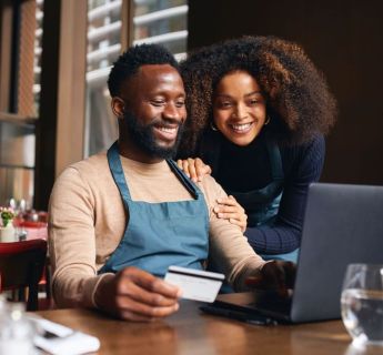 business couple with credit card